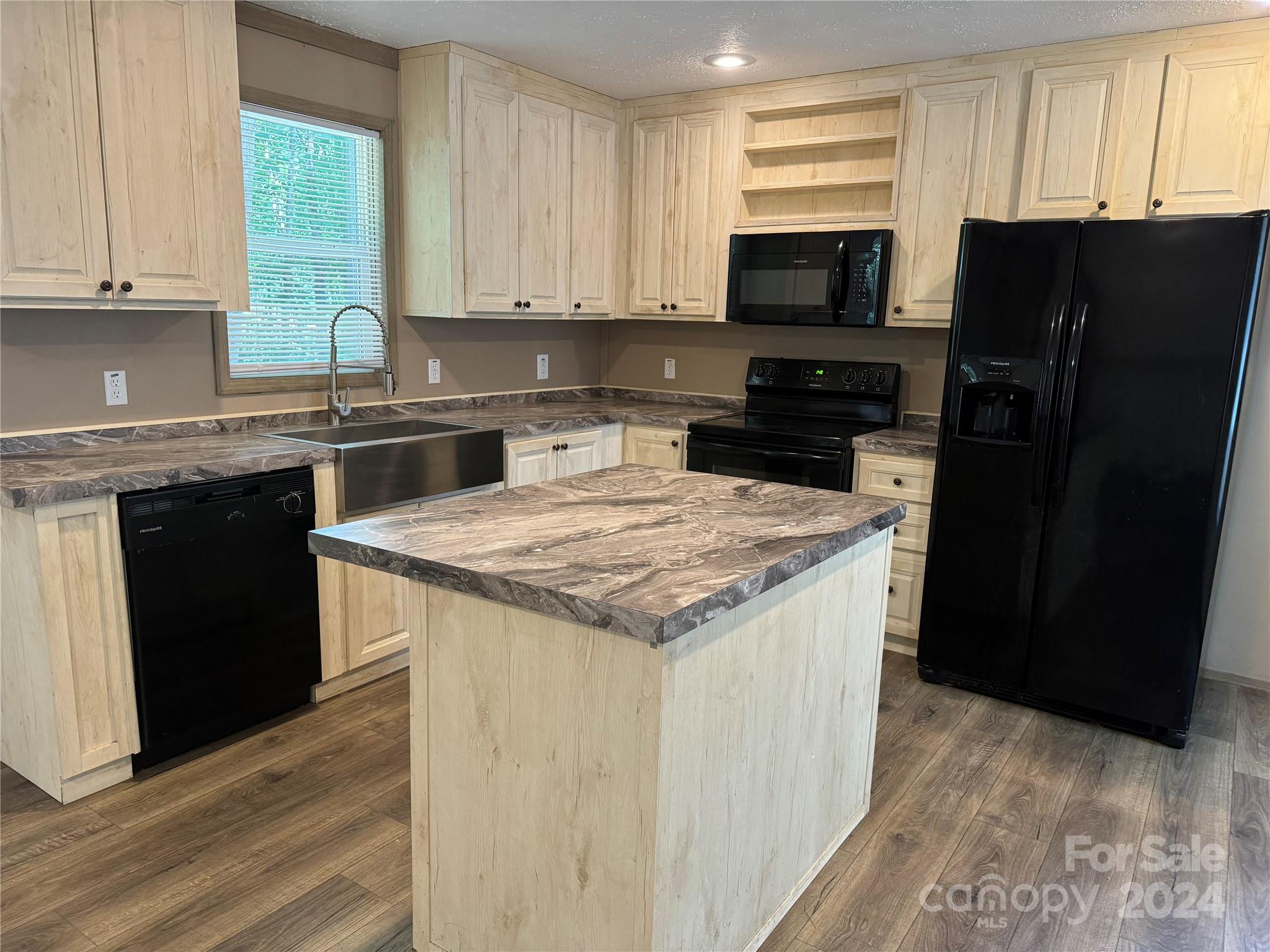4730 Crystal Creek Road Morganton, NC 28655 - Photo 10 of 17 a kitchen with a sink stove top oven and refrigerator