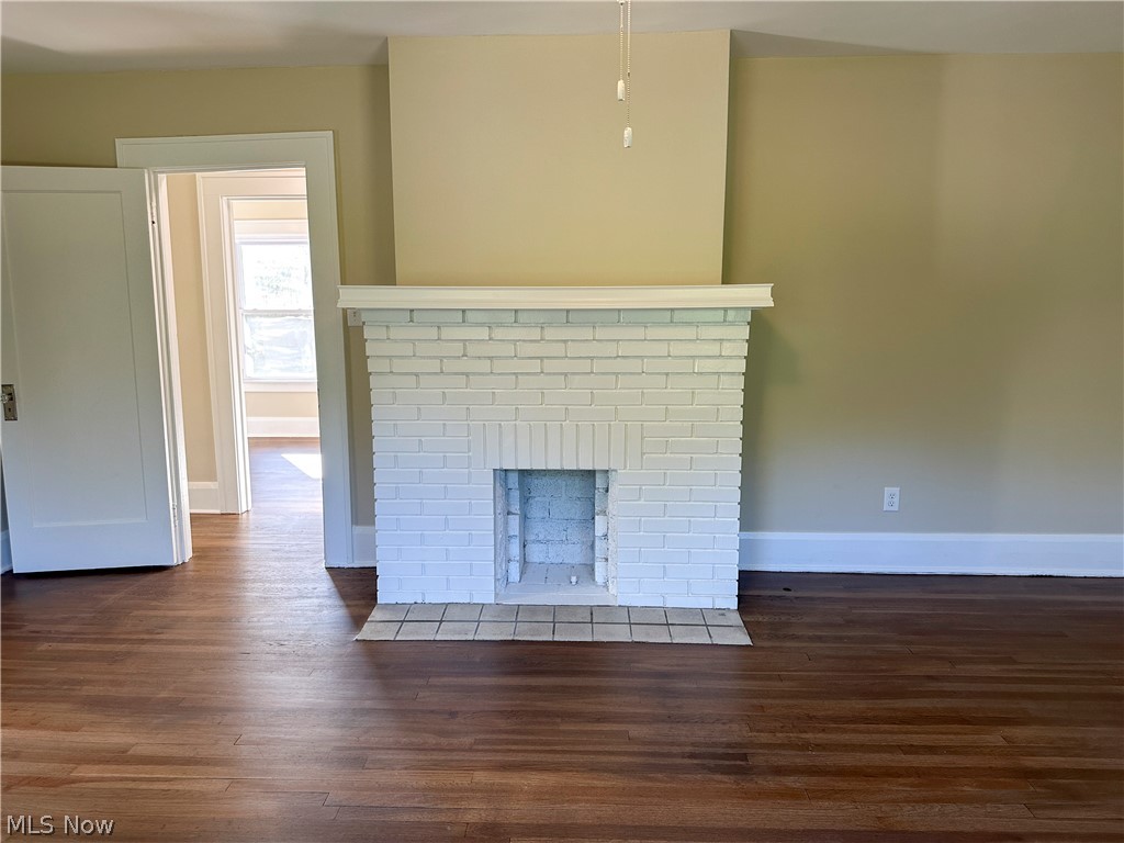 3079 Kiwatha Road Youngstown, OH 44511 - Photo 16 of 27 Bedroom with white fireplace and hardwood floors