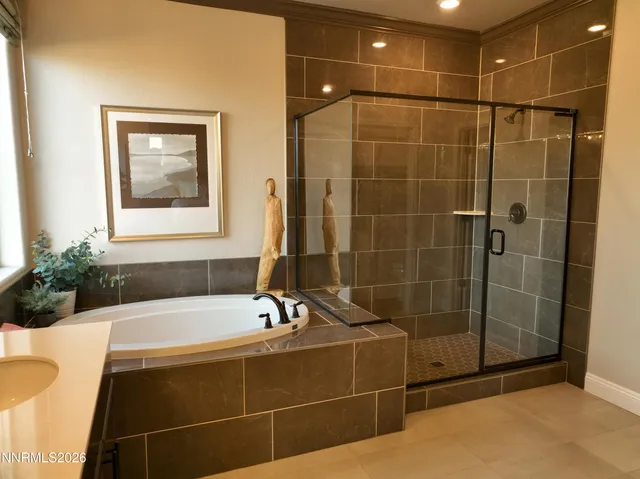 a bathroom with a bathtub and a shower