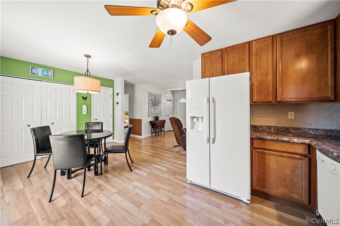 4833 Wilconna Road Chesterfield, VA 23832 - Photo 15 of 29 a kitchen with stainless steel appliances granite countertop a refrigerator a microwave a stove and white cabinets with wooden floor