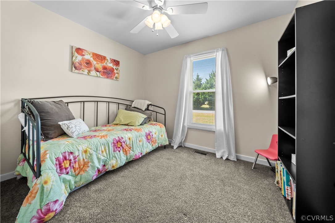 4833 Wilconna Road Chesterfield, VA 23832 - Photo 21 of 29 a bedroom with bed and a chandelier