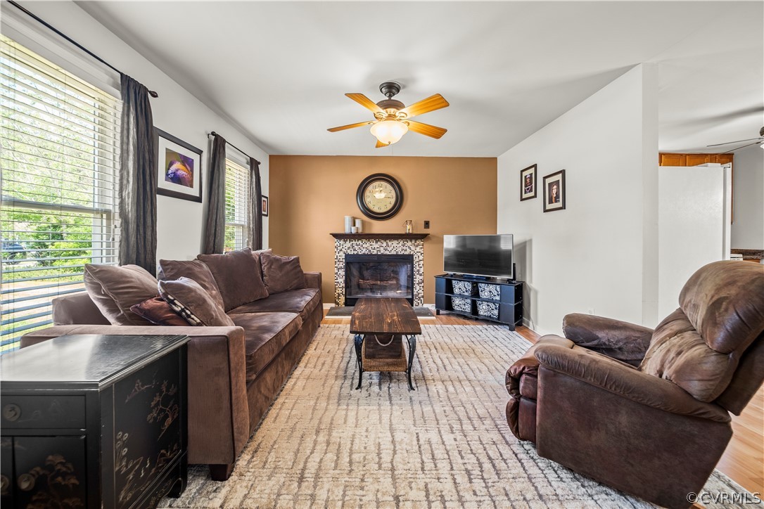 4833 Wilconna Road Chesterfield, VA 23832 - Photo 6 of 29 a living room with furniture a fireplace and a large window