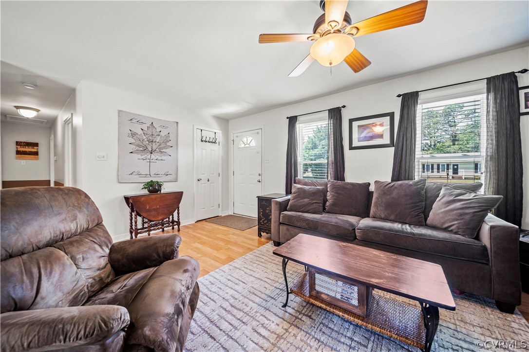 4833 Wilconna Road Chesterfield, VA 23832 - Photo 9 of 29 a living room with furniture a chandelier and a window