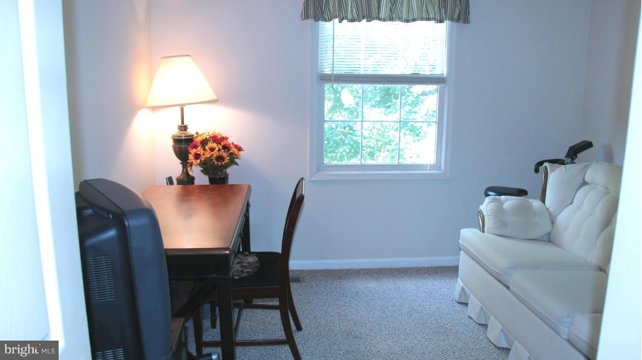 13969 Baton Rouge Court Centreville, VA 20121 - Photo 17 of 20 a dining room with furniture and a window