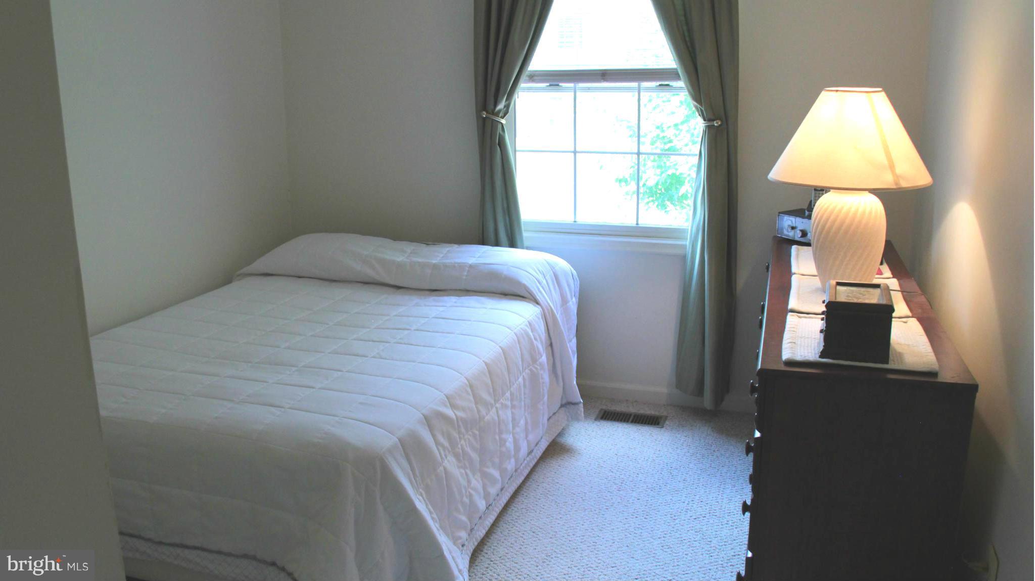 13969 Baton Rouge Court Centreville, VA 20121 - Photo 18 of 20 a bedroom with a bed and a window