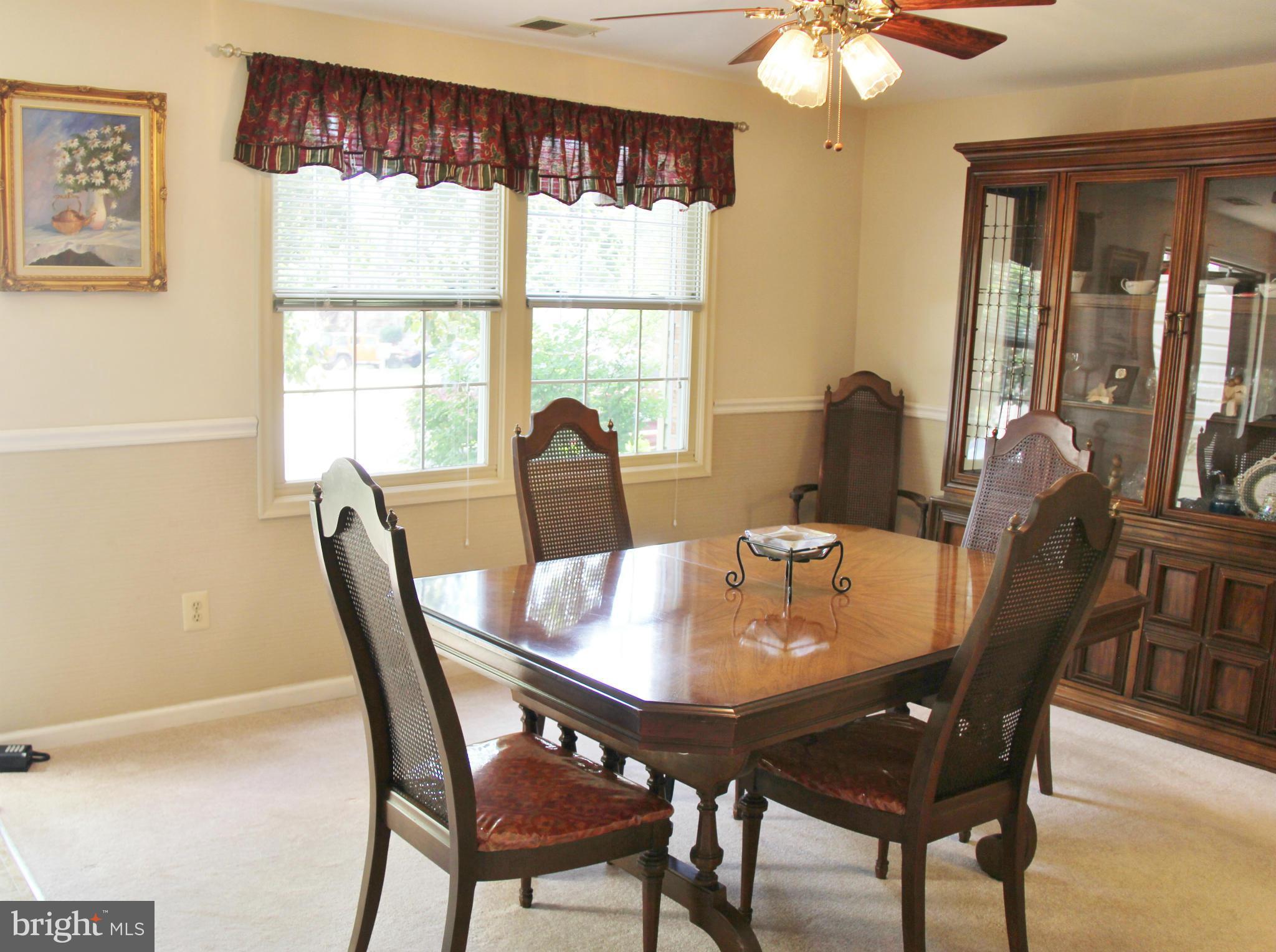 13969 Baton Rouge Court Centreville, VA 20121 - Photo 4 of 20 a view of a dining room with furniture window and outside view
