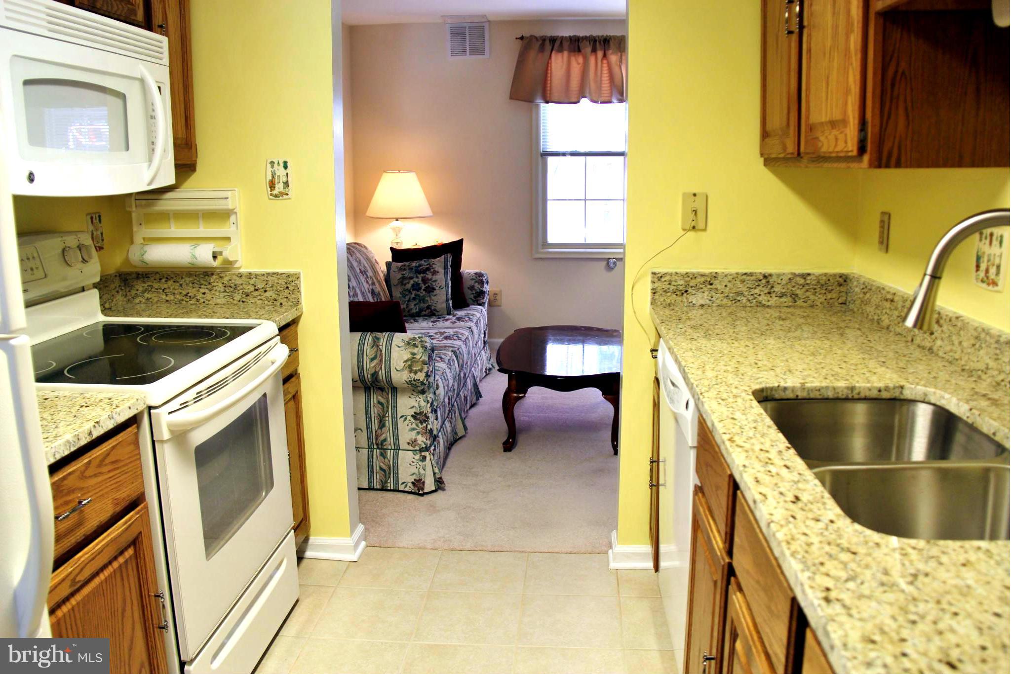 13969 Baton Rouge Court Centreville, VA 20121 - Photo 9 of 20 a kitchen with a sink and a stove top oven