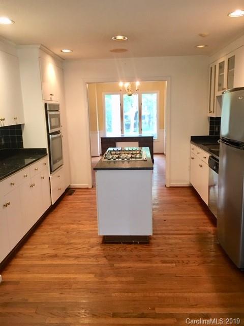 12905 Hamilton Pl Drive Fort Mill, SC 29708 - Photo 2 of 12 a large kitchen with stainless steel appliances granite countertop a stove a sink and a microwave