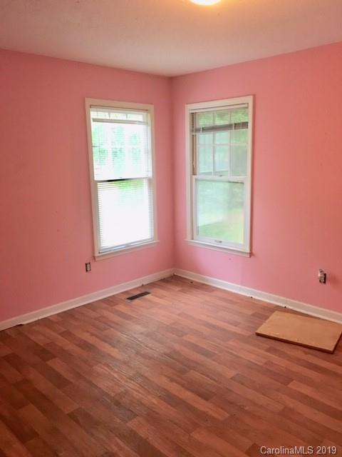 12905 Hamilton Pl Drive Fort Mill, SC 29708 - Photo 11 of 12 an empty room with wooden floor and windows