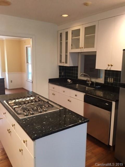 12905 Hamilton Pl Drive Fort Mill, SC 29708 - Photo 3 of 12 a kitchen with granite countertop a stove and a sink