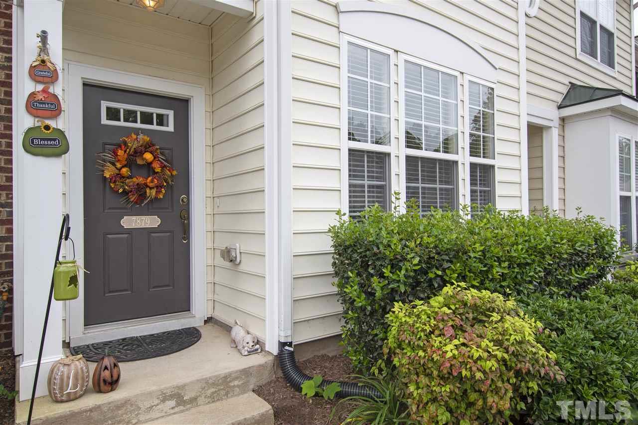 7879 Spungold Street Raleigh, NC 27617 - Photo 2 of 25 a view of front door and potted plants