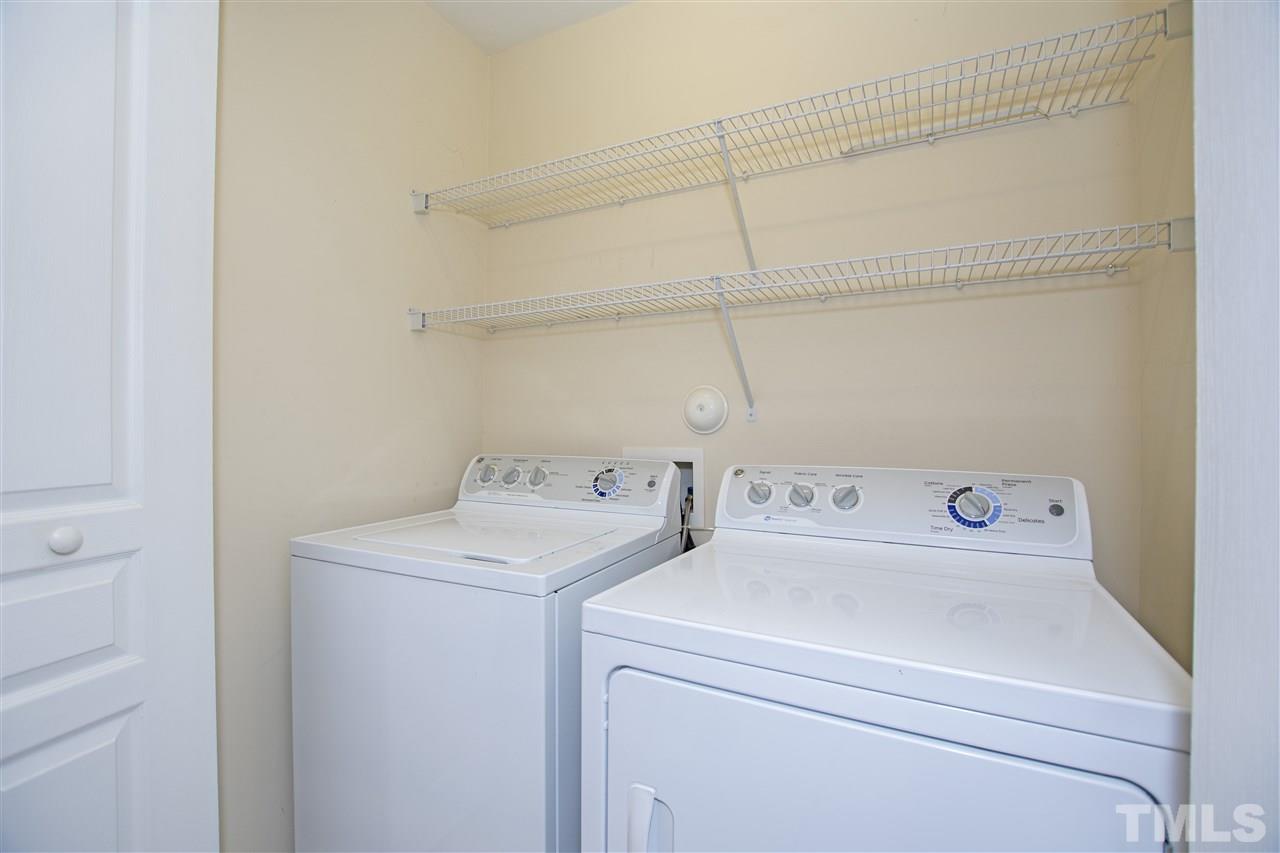 7879 Spungold Street Raleigh, NC 27617 - Photo 22 of 25 a utility room with dryer and washer