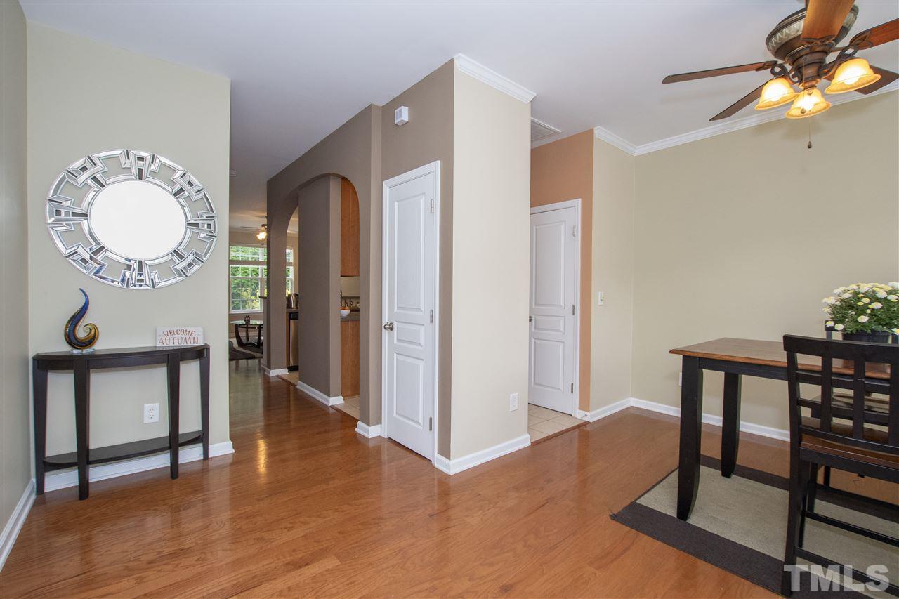 7879 Spungold Street Raleigh, NC 27617 - Photo 7 of 25 a view of a livingroom with furniture and wooden floor