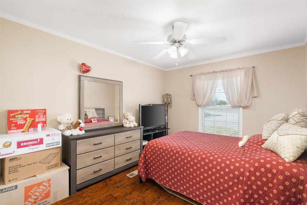 360 Rockcrest Road New Hope, TX 75071 - Photo 14 of 20 a bedroom with a bed dresser and window
