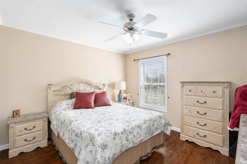 360 Rockcrest Road New Hope, TX 75071 - Photo 15 of 20 a bedroom with a bed and a dresser