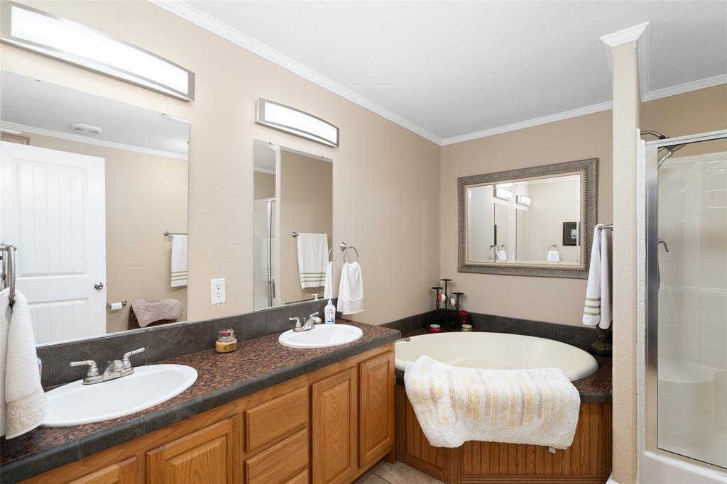 360 Rockcrest Road New Hope, TX 75071 - Photo 17 of 20 a bathroom with a granite countertop sink and a mirror