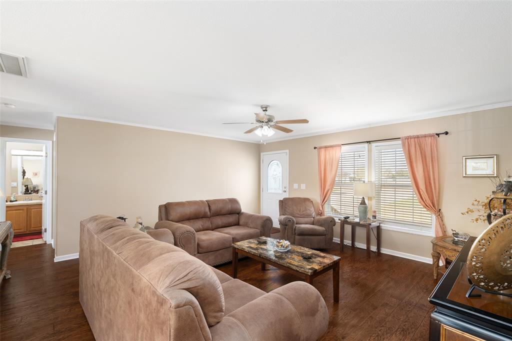 360 Rockcrest Road New Hope, TX 75071 - Photo 6 of 20 a living room with furniture ceiling fan and a window