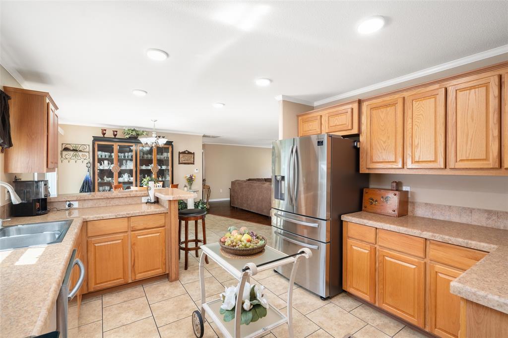 360 Rockcrest Road New Hope, TX 75071 - Photo 20 of 20 a kitchen with stainless steel appliances granite countertop a refrigerator and cabinets