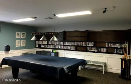 a living room with furniture a rug and a table
