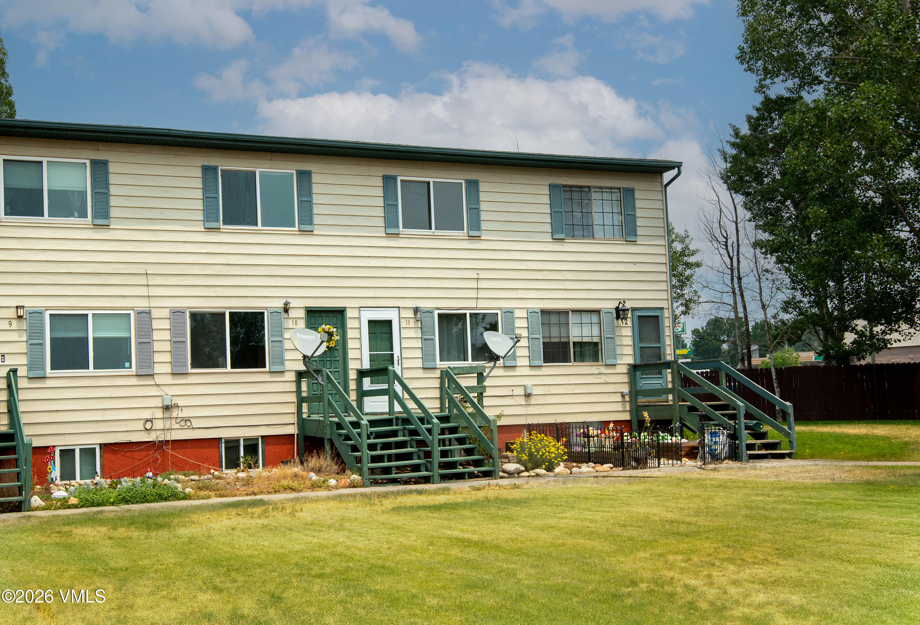 85 Chambers Avenue, Unit 10 Eagle, CO 81631 - Photo 33 of 41 a front view of a house with a yard