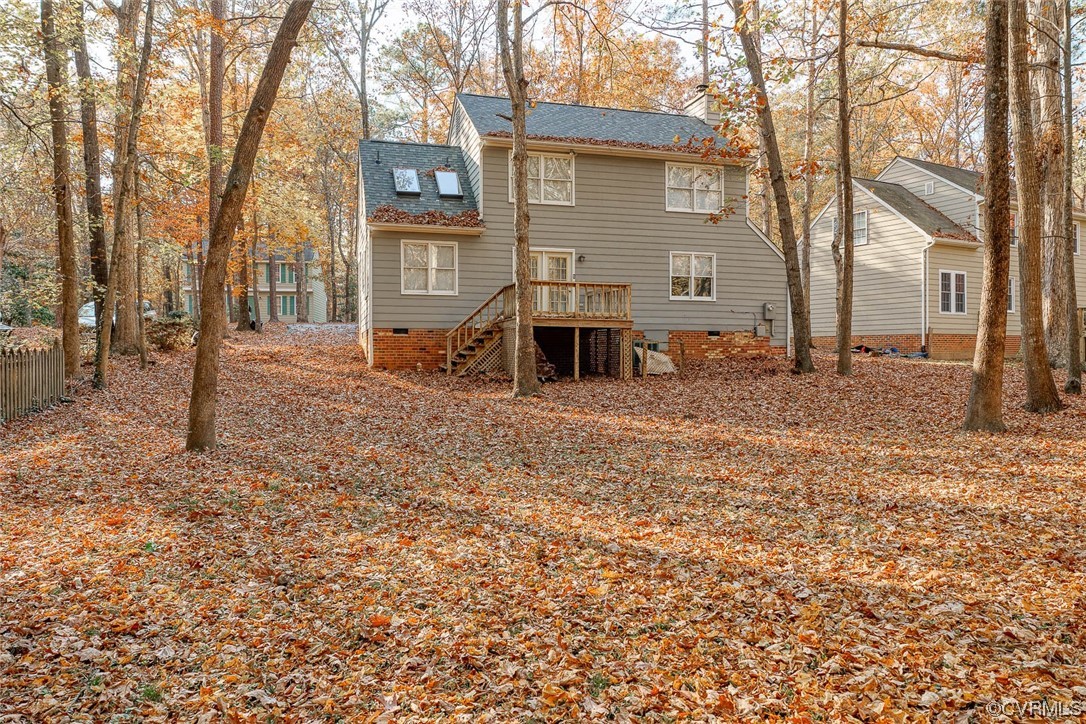 5813 Mill Spring Road Midlothian, VA 23112 - Photo 2 of 7 a backyard of a house with large trees and a tree