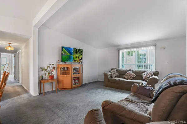 a living room with furniture and window