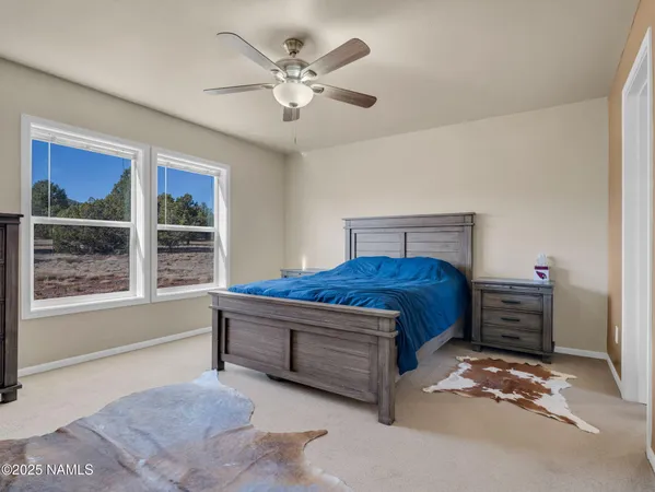 a living room with a bed furniture and window