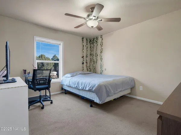 a bedroom with a bed furniture and a window