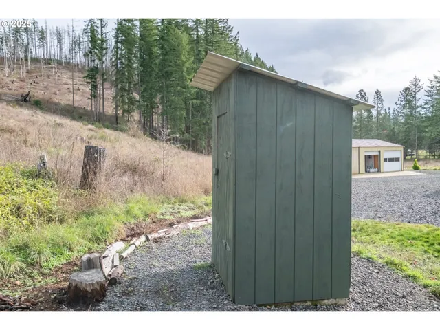 a backyard of a house with lots of green space
