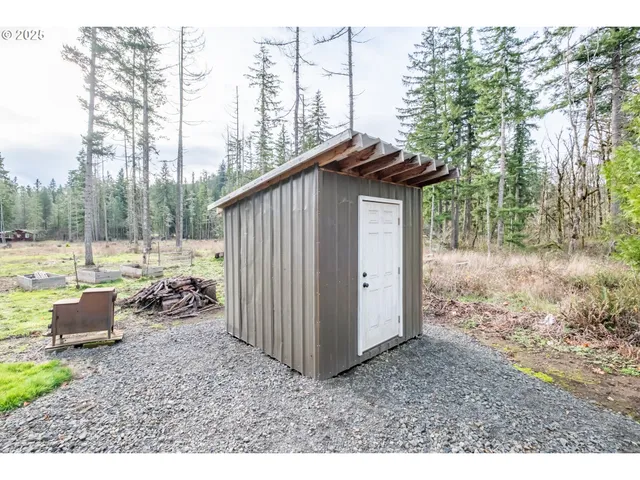 a backyard of a house with outdoor seating