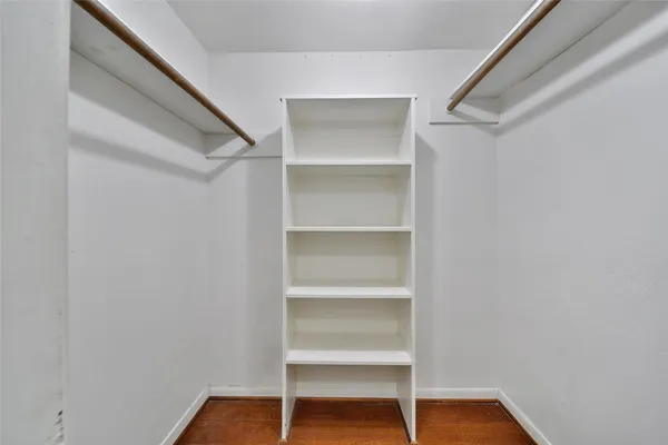 a view of an empty walk in closet