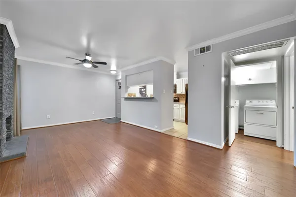 a view of a livingroom with wooden floor