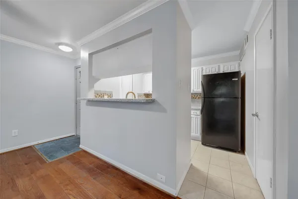a view of a kitchen cabinets and a wooden floor
