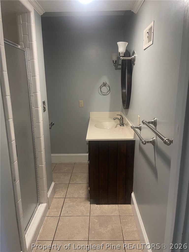 2515 Fort Bragg Road Fayetteville, NC 28303 - Photo 14 of 23 a bathroom with a sink and a mirror