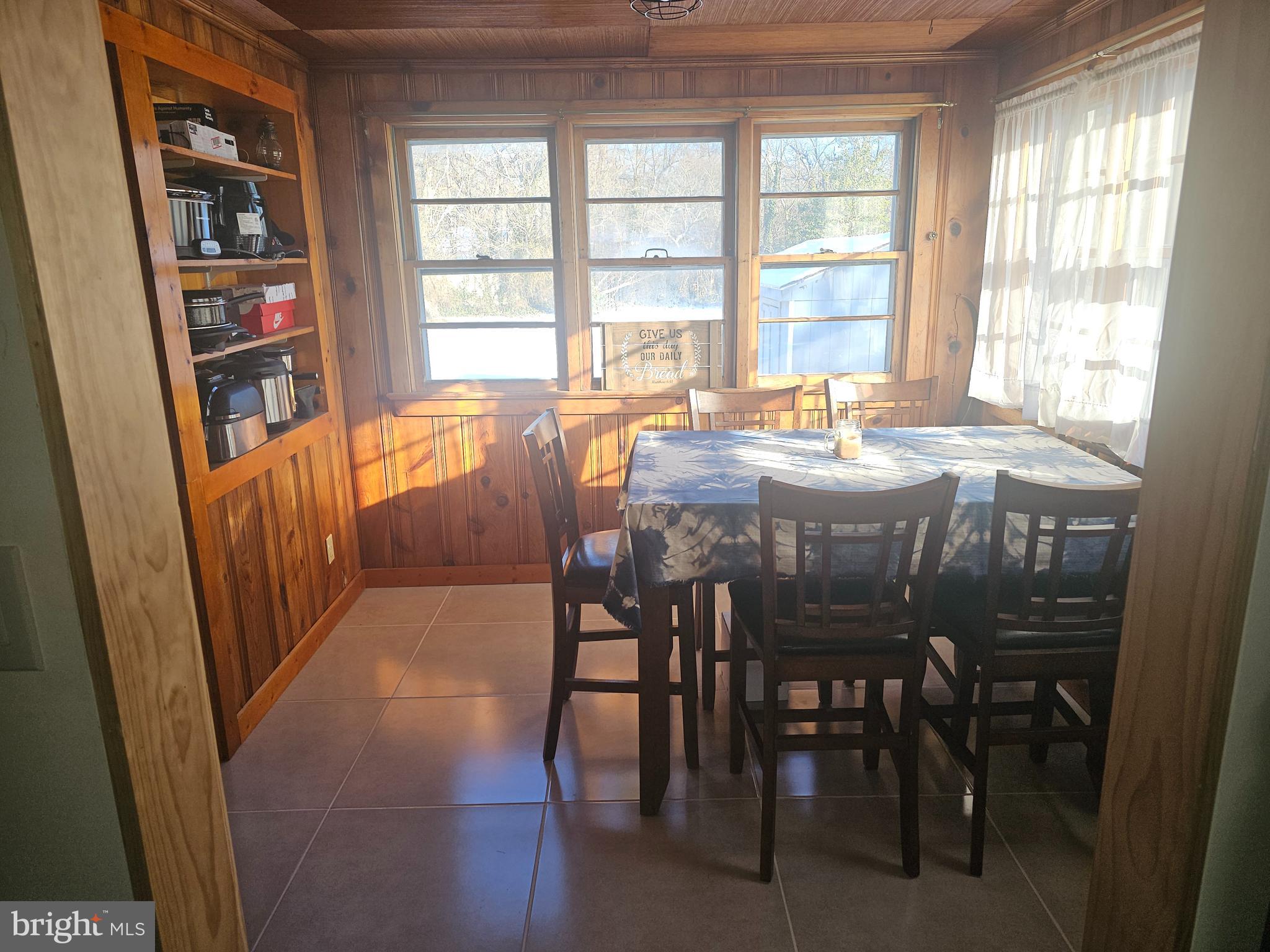 2891 Union Road Vineland, NJ 08361 - Photo 12 of 25 a dining room with furniture and a floor to ceiling window