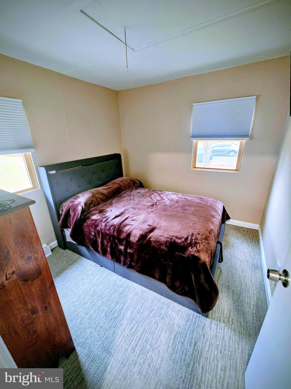 2891 Union Road Vineland, NJ 08361 - Photo 17 of 25 a bedroom with a bed and a night stand