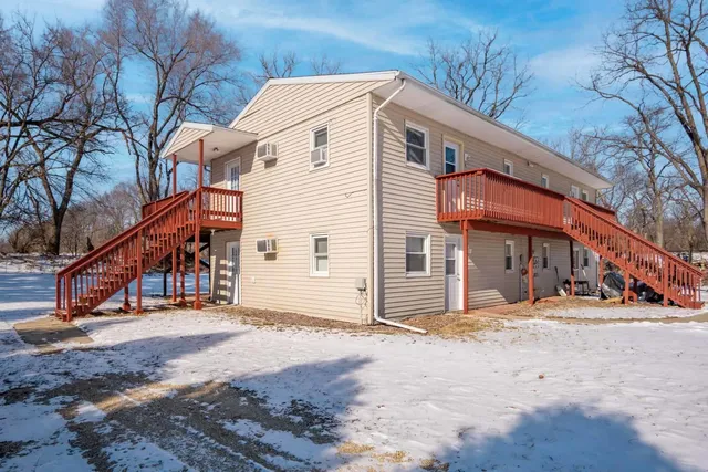 a view of a house with large trees