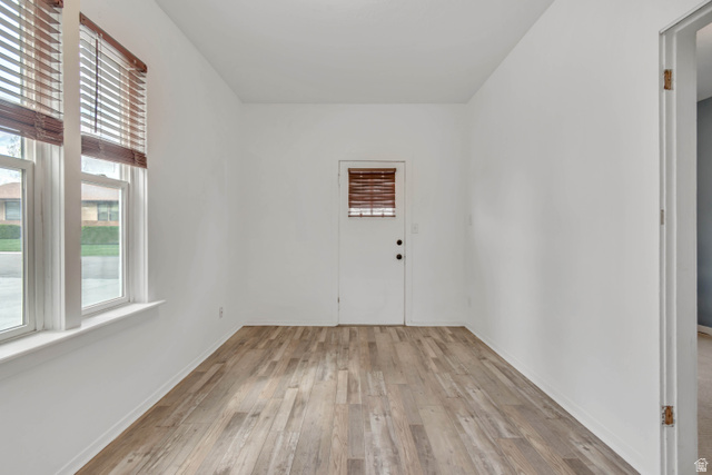 8831 South 400 East Sandy, UT 84070 - Photo 10 of 26 Foyer entrance featuring light wood-style floors and healthy amount of natural light