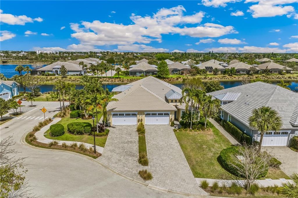 6939 Cay Court Naples, FL 34113 - Photo 23 of 31 Aerial perspective of suburban area featuring a nearby body of water
