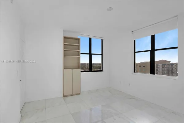 a view of an empty room with a window
