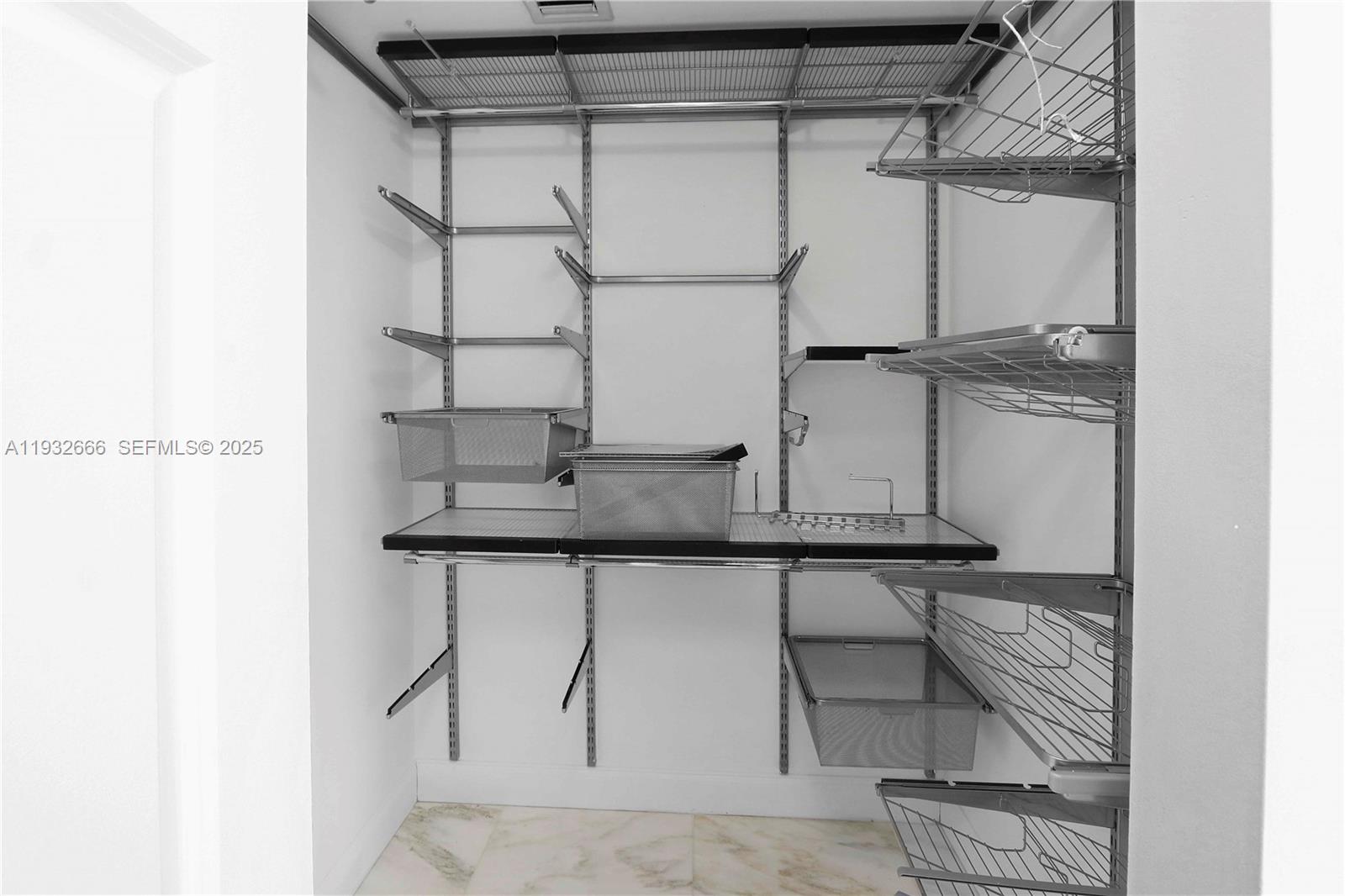 888 Douglas Road, Unit 1203 Coral Gables, FL 33134 - Photo 20 of 27 a bathroom with a sink and a mirror