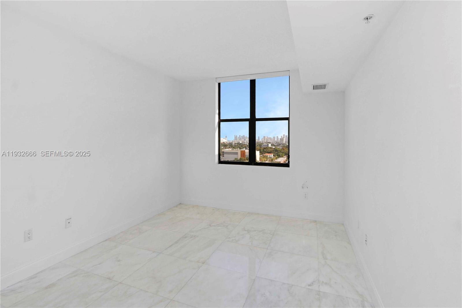 888 Douglas Road, Unit 1203 Coral Gables, FL 33134 - Photo 25 of 27 an empty room with a window