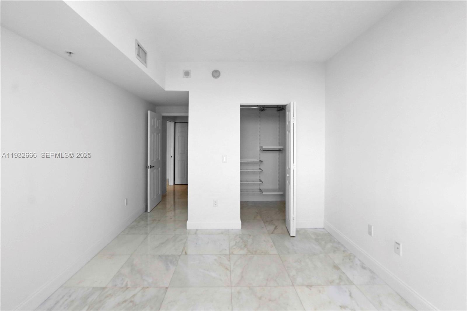 888 Douglas Road, Unit 1203 Coral Gables, FL 33134 - Photo 26 of 27 a view of an empty room and closet