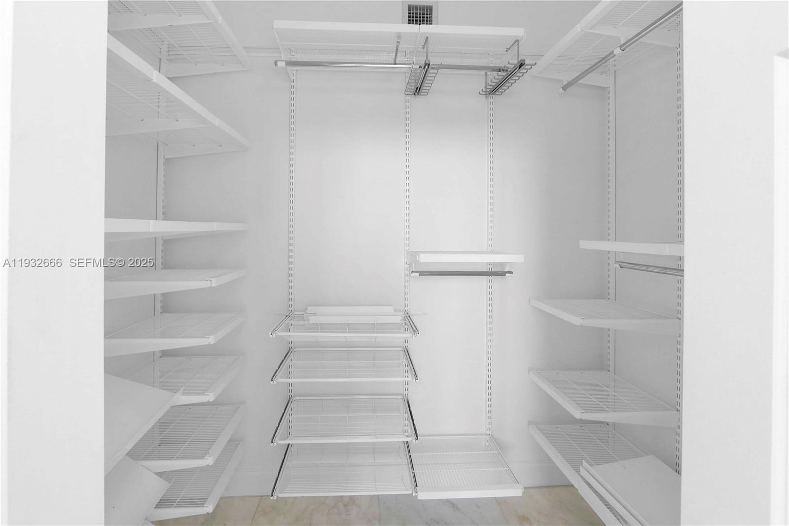 888 Douglas Road, Unit 1203 Coral Gables, FL 33134 - Photo 27 of 27 a view of walk in closet with empty racks