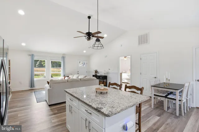 a bedroom with a large bed and a tv