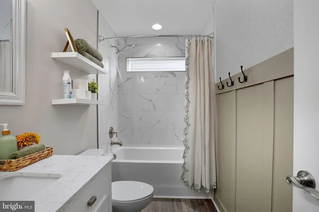 a bathroom with a sink vanity and mirror