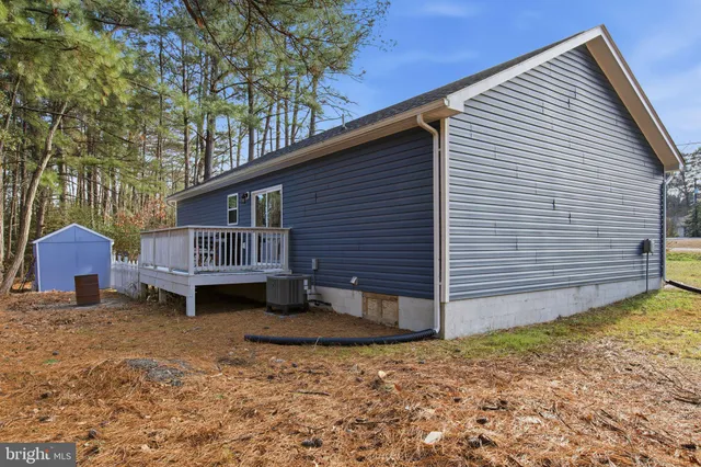 a front view of a house with wooden fence