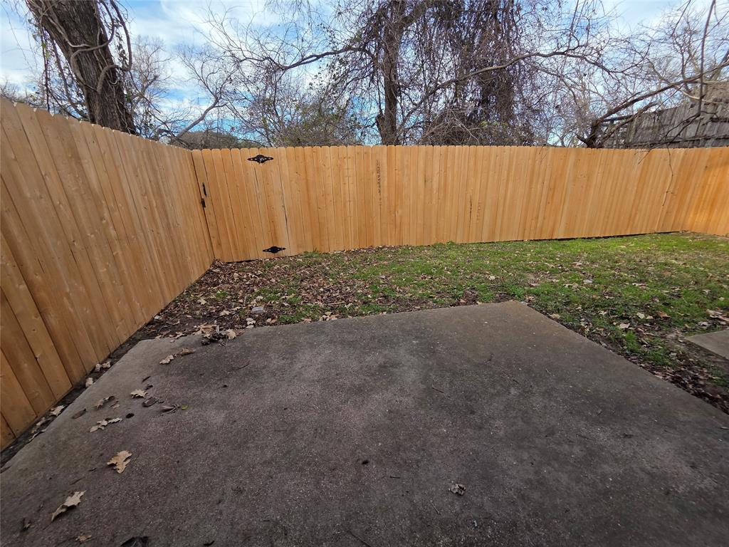 1012 Lynn Street, Unit B Weatherford, TX 76086 - Photo 2 of 8 Fenced backyard featuring a patio