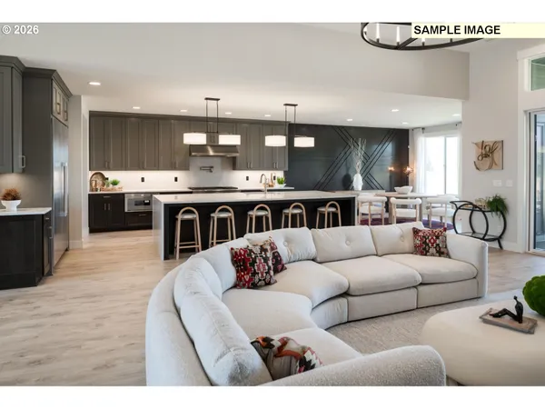 a living room with fireplace furniture and decor