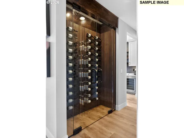 a kitchen with kitchen island a counter top space cabinets and stainless steel appliances with cabinets